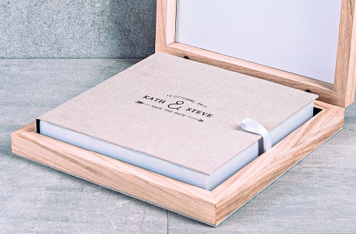 Serie UNIQUE | Fotolibro professionale con scatola in legno e copertina in tessuto